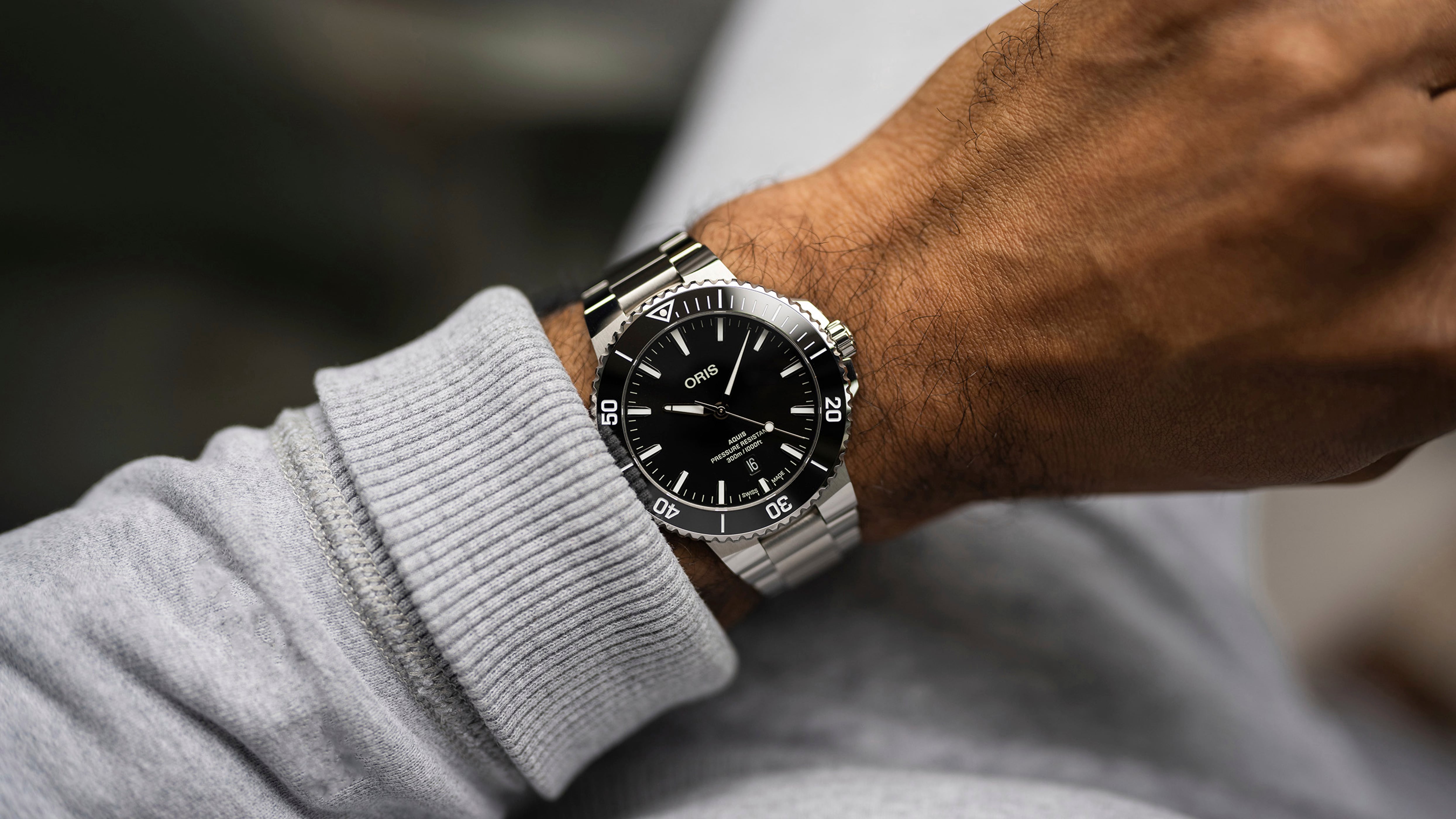 Oris Aquis Date Relief with grey dial and red rubber strap