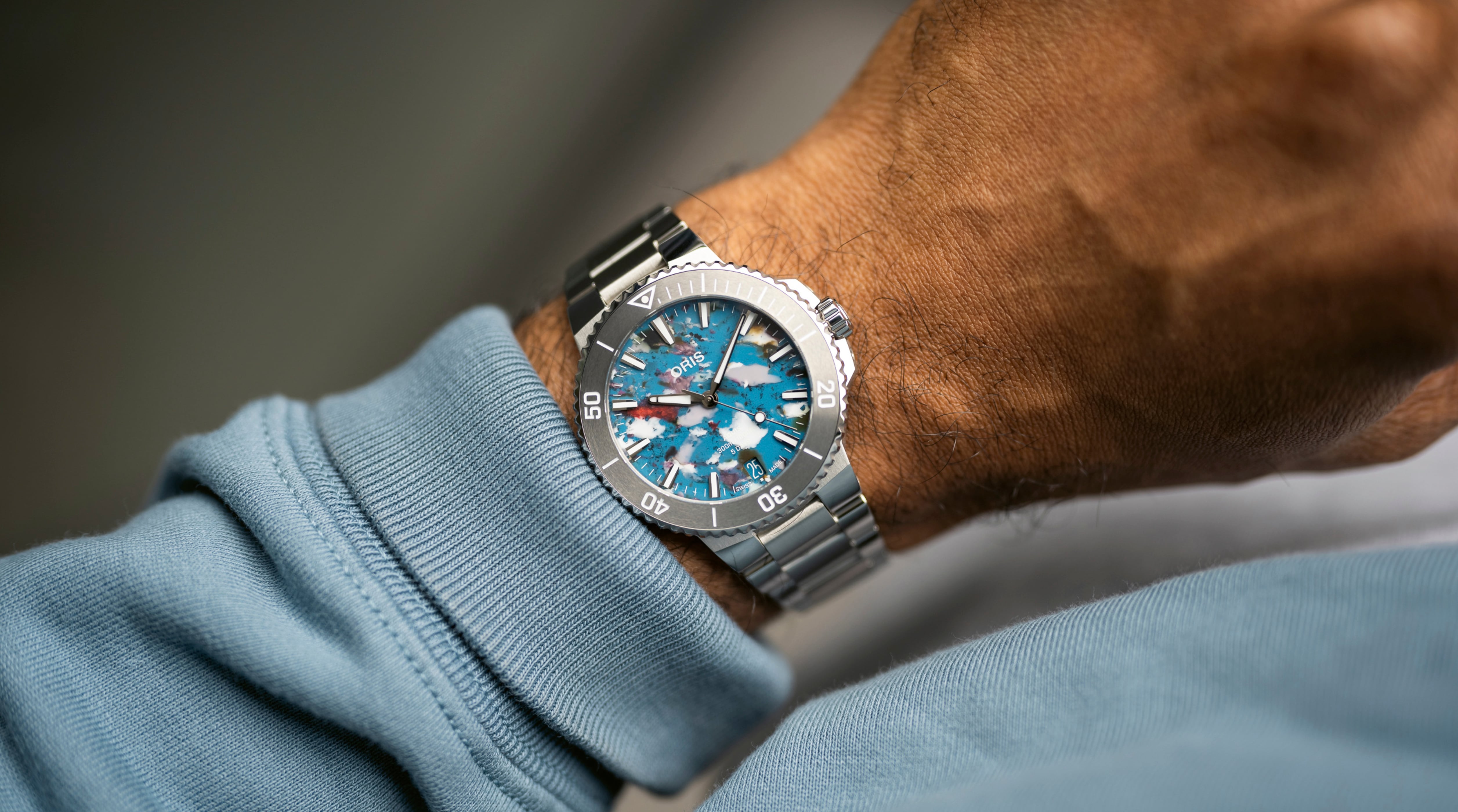 Oris Aquis Date Upcycle Calibre 400 with multicolor recycled PET dial and steel bracelet